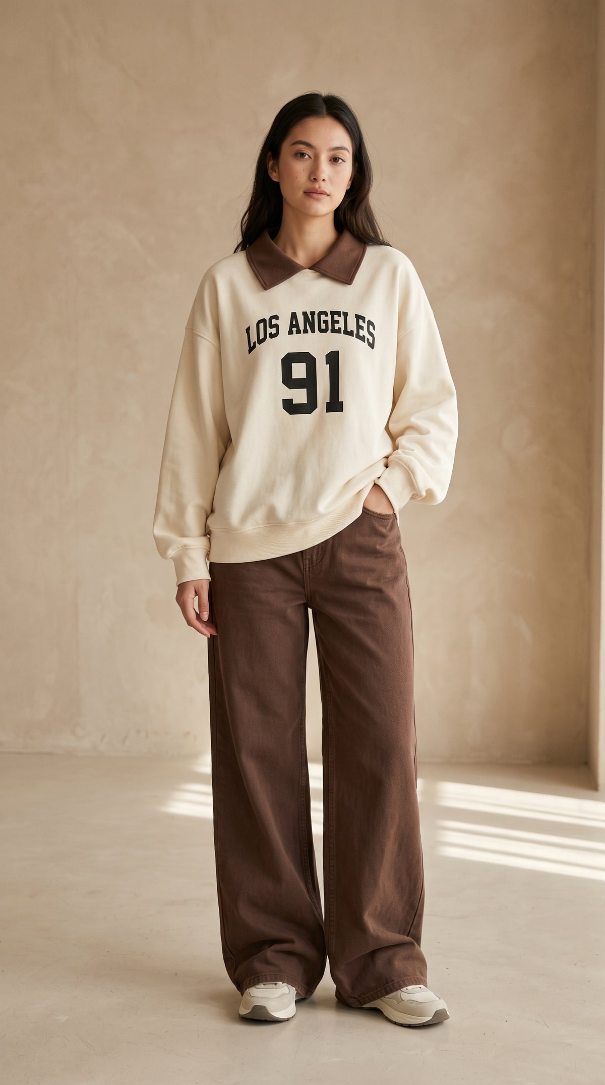 Cream Los Angeles 91 collared top with brown wide-leg trousers